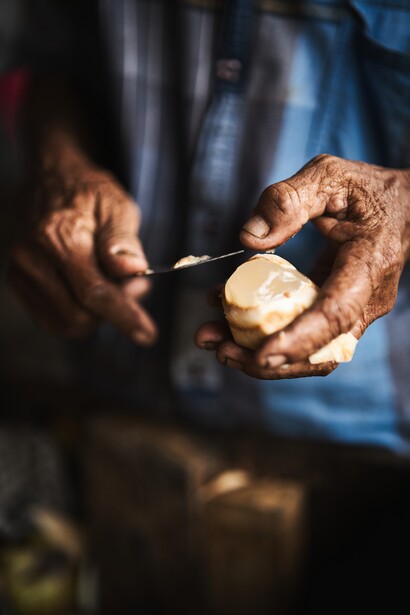 The working hands, the fruit and the knife of the fruit seller