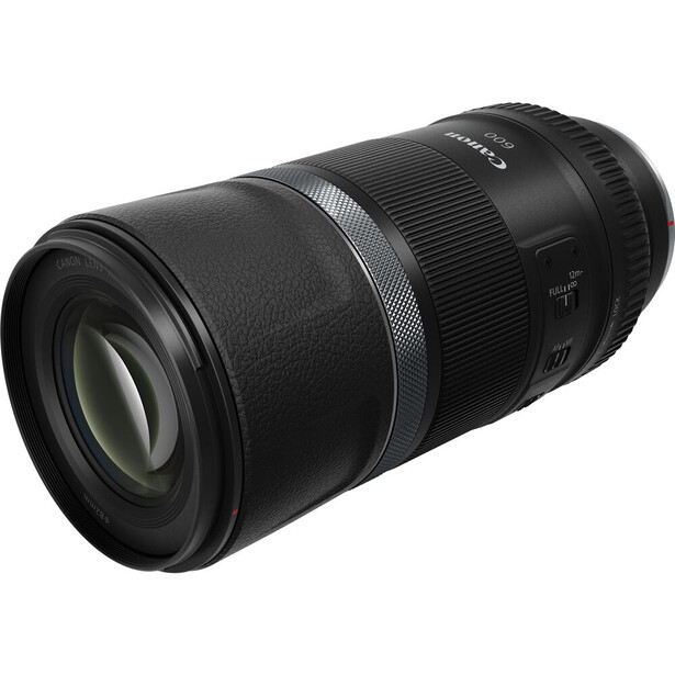 Black telephoto zoom lens with ribbed focus ring and textured barrel against white background.