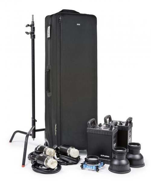 Professional photography lighting kit with rolling case, stands, softboxes, and reflectors.