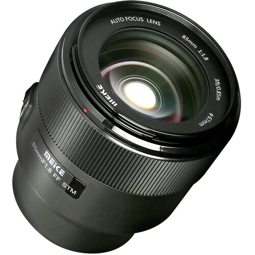 Auto-focus prime lens with ribbed black barrel and multi-element glass front element.