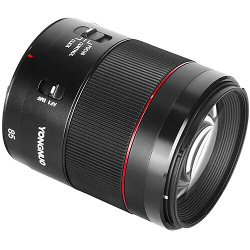 Black telephoto lens with red accent stripe and focus ring markings against white background.