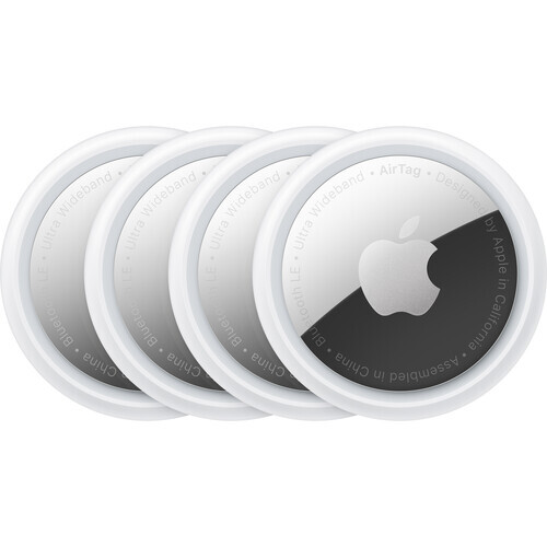 Four white circular tracking devices with dark sensor sections arranged in a row.