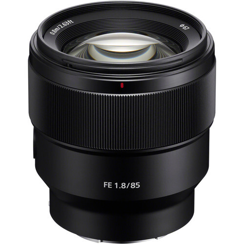 Sony FE 1.8/85 prime lens with black barrel and front element visible against white background.