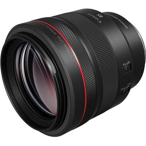 Black telephoto lens with red accent stripe and glass elements visible through the barrel.