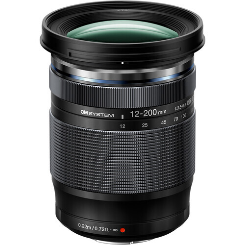 Olympus M.Zuiko Digital ED 12-200mm f/3.5-6.3 telephoto zoom lens with black barrel and green lens elements visible.