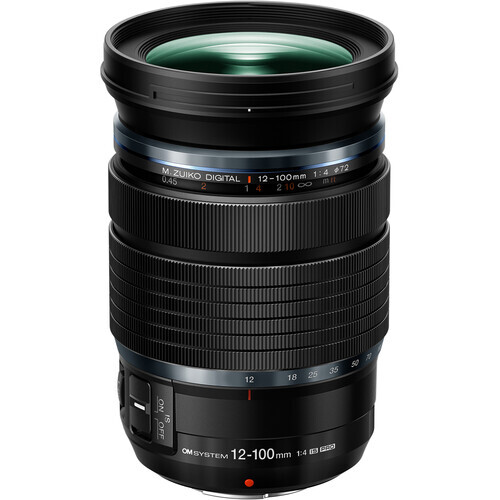 Olympus M. Zuiko Digital ED 12-100mm f/4 IS PRO zoom lens with green-tinted front element.