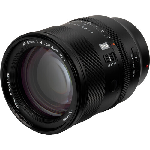 Black telephoto lens with f/1.4 aperture mounted against white background.