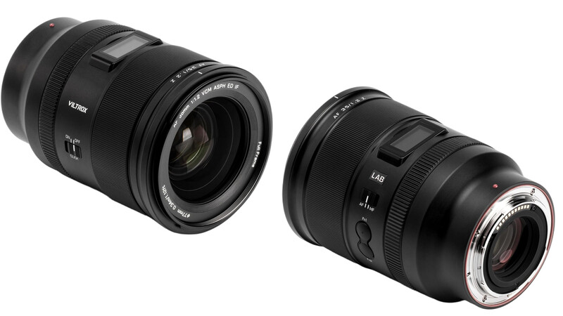 Two black camera lenses displayed side by side against a white background.