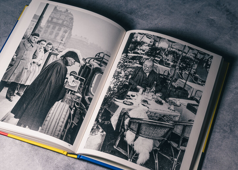 Open book displaying two black and white photographs from what appears to be a mid-century film or documentary.