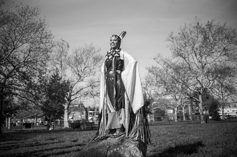 Native American standing on a rock