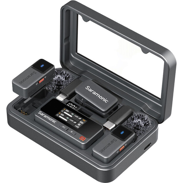 Wireless microphone system kit with charging case, containing two handheld mics and receiver unit.