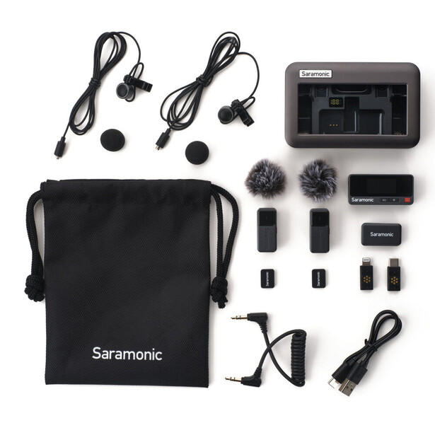 Saramonic wireless microphone system with lavalier mics, receiver, transmitters, and accessories laid out flat.