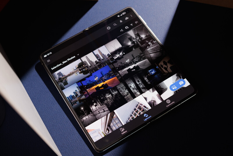 Smartphone displaying a grid of architectural and urban photography thumbnails with various compositions and lighting conditions.