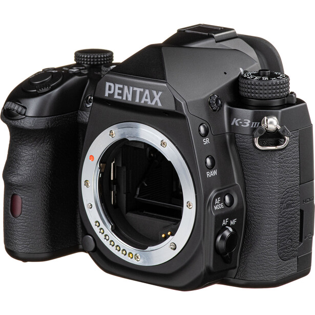 Pentax K3 Mark III DSLR camera body shown from front with mirror open and lens mount visible.