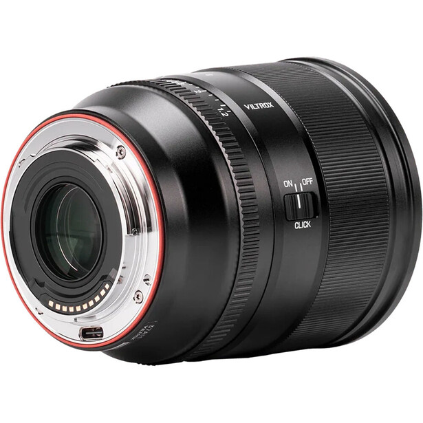 Telephoto zoom lens with red accent ring on rear element and focus distance scale markings.