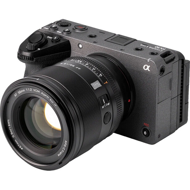 Sony Alpha mirrorless camera with attached prime lens on white background.