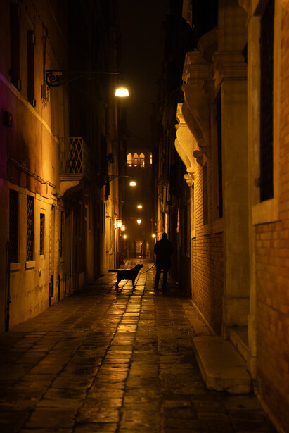 RAW File: A man and his dog on a cold Venetian night.