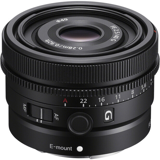 Sony E-mount prime lens with manual focus ring and depth-of-field scale visible.