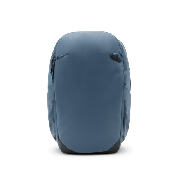 Blue-gray hardshell backpack with rounded top and side straps, shown against white background.