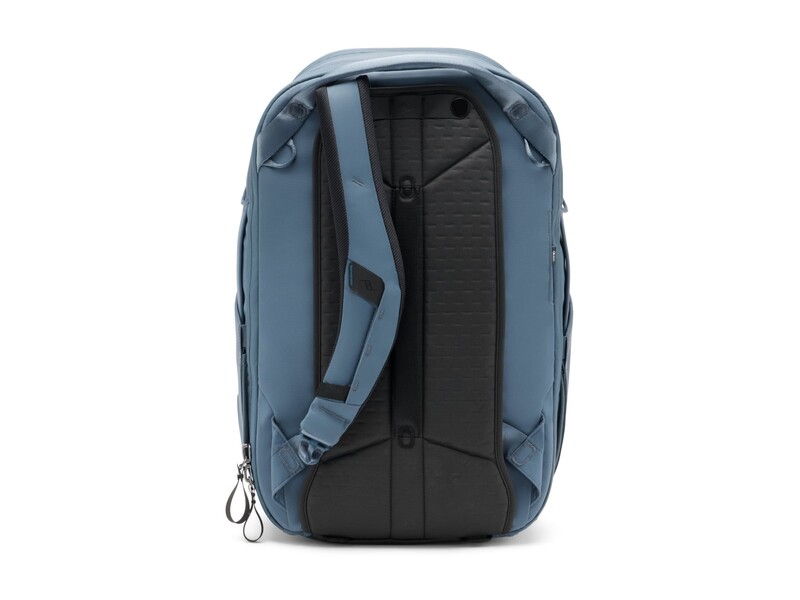 Blue and black camera backpack photographed from the rear, showing padded shoulder straps and ventilated back panel.