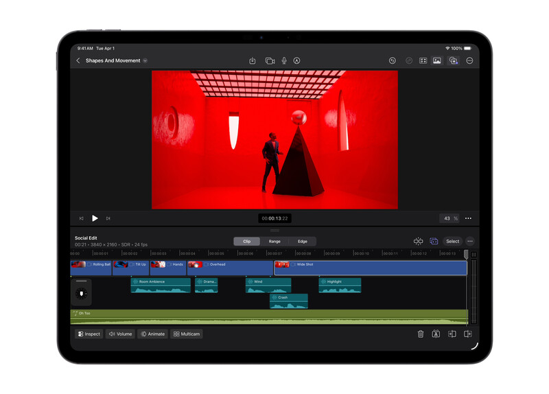 Screenshot of video editing software with red-toned footage in the preview window and multiple color-coded timeline tracks below.