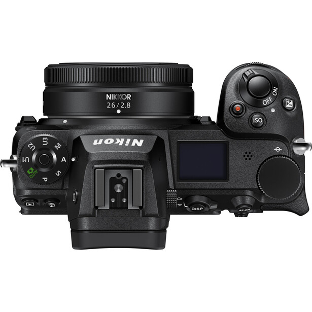Overhead view of a mirrorless camera with attached prime lens and wireless remote control.
