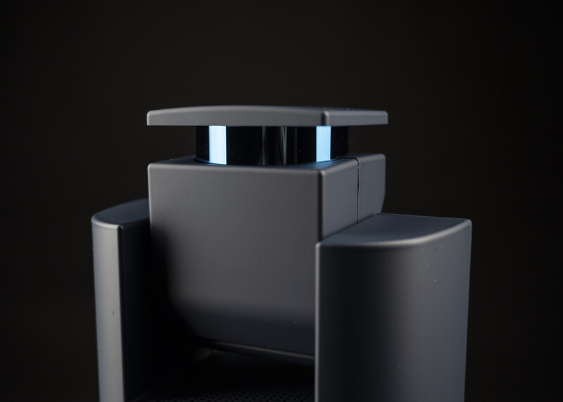 3D render of a modular furniture piece with gray cylindrical columns and a central unit against a dark background.