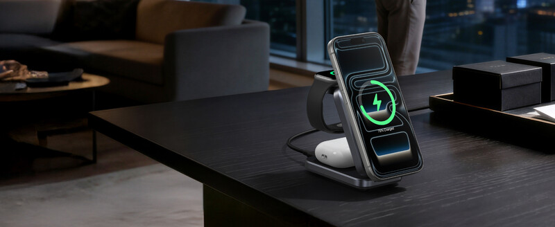 Smartphone on wireless charging stand displaying green charging indicator with glowing animation.