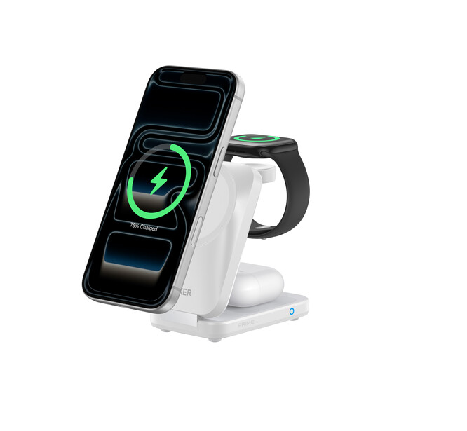 White wireless charging dock with smartphone and smartwatch simultaneously charging, green battery indicator visible on phone screen.