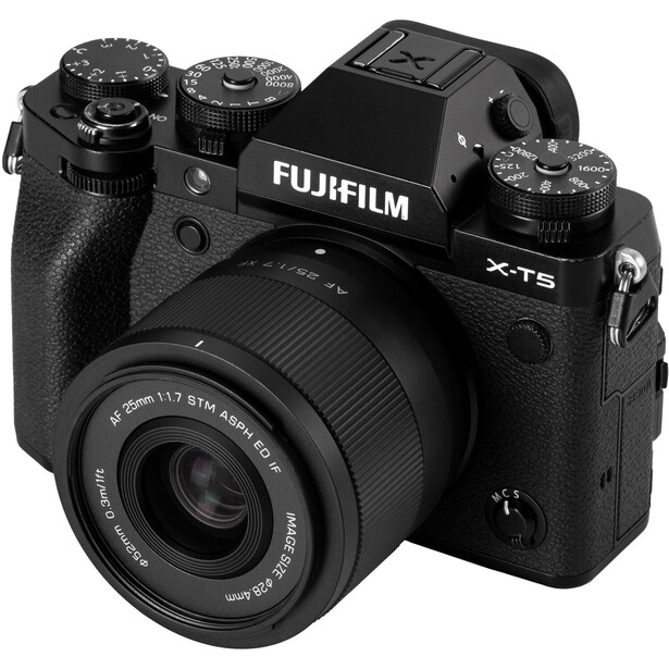 Fujifilm X-T5 mirrorless camera with kit lens attached, shown from front-left angle against white background.