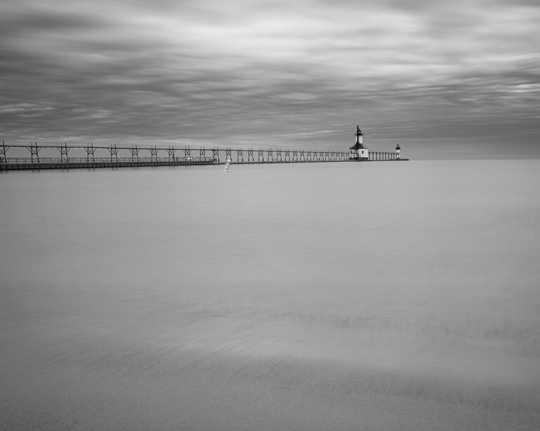 Black and white long exposure photograph of a lighthouse