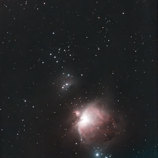 Orion Nebula with bright central core and diffuse gas clouds surrounded by stars.