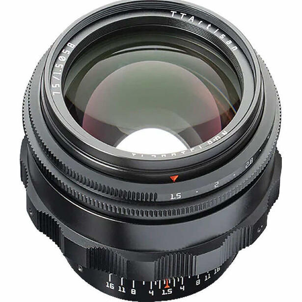 Fast prime lens with large aperture and manual focus ring displayed against white background.