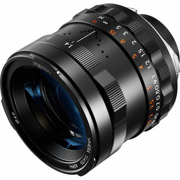 Fast prime lens with manual focus ring and aperture scale, featuring blue-coated glass elements.