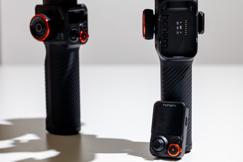 Two black gimbal stabilizers with red accents displayed side-by-side against a white background.