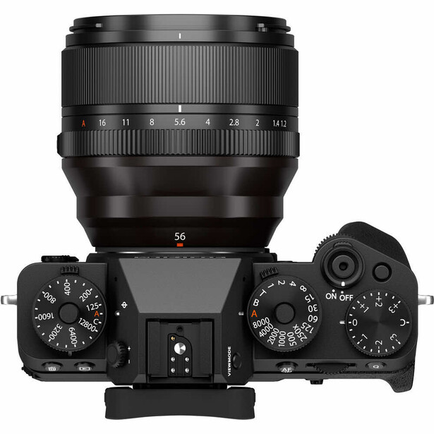 Top-down view of a mirrorless camera body with attached 56mm lens and dual control dials.