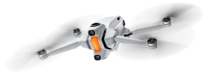 Illustration of a compact quadcopter drone with four propellers and orange accents on its central hub.