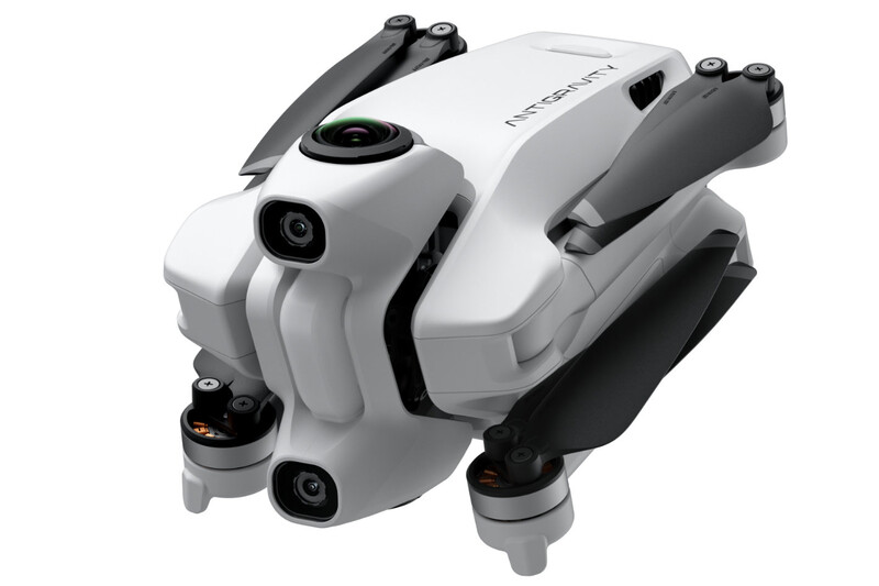 White and gray compact drone with folded arms and dual camera system shown from angled side view.