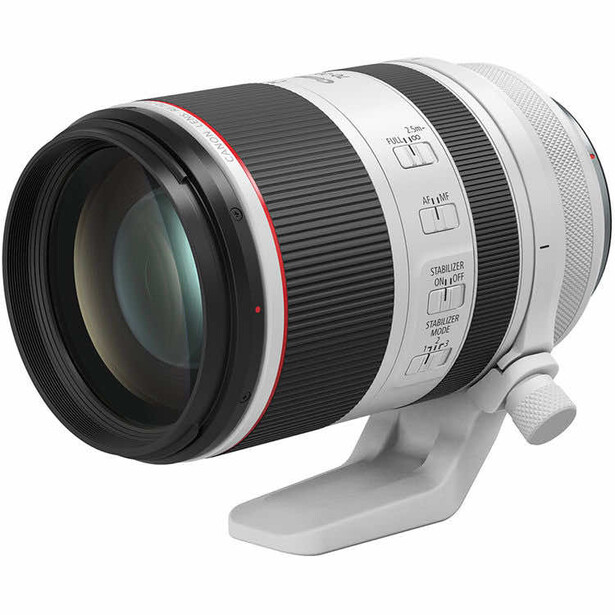 White telephoto lens with black barrel and tripod collar against white background.