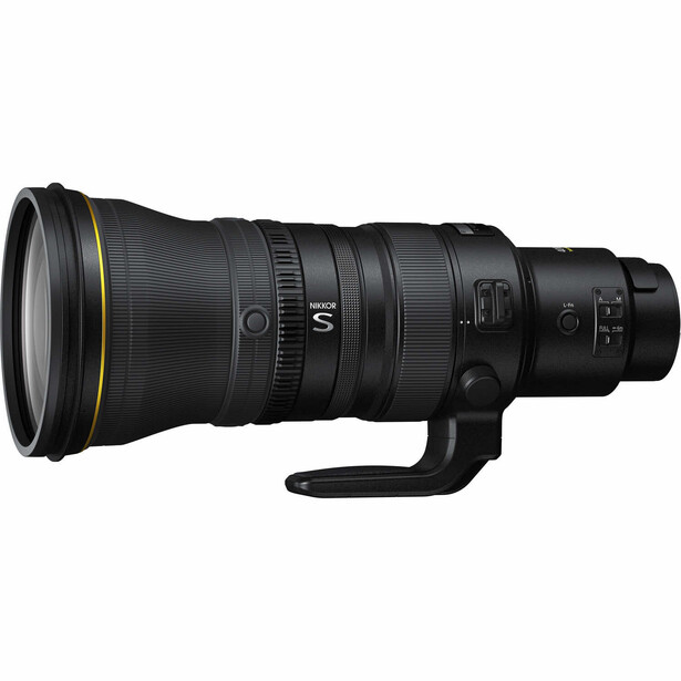 Black telephoto lens with gold accents and control rings, viewed from the side against a white background.