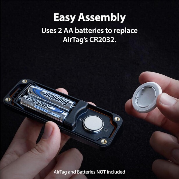 Illustration showing two AA batteries inserted into a black battery compartment next to a white circular component being held by hands.