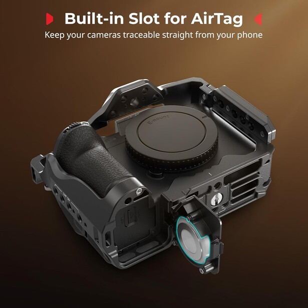 Rugged camera cage with built-in AirTag slot mounted on top, shown against brown gradient background.