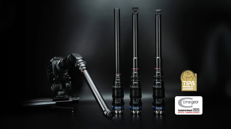 Professional wireless microphone system with three transmitter units and receiver displayed alongside camera equipment.