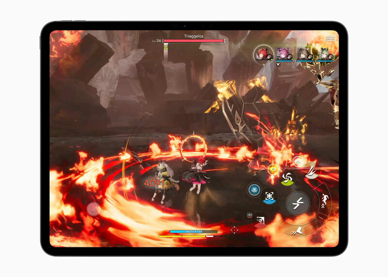 Screenshot of action RPG gameplay showing character combat with glowing fire effects and UI elements on tablet display.