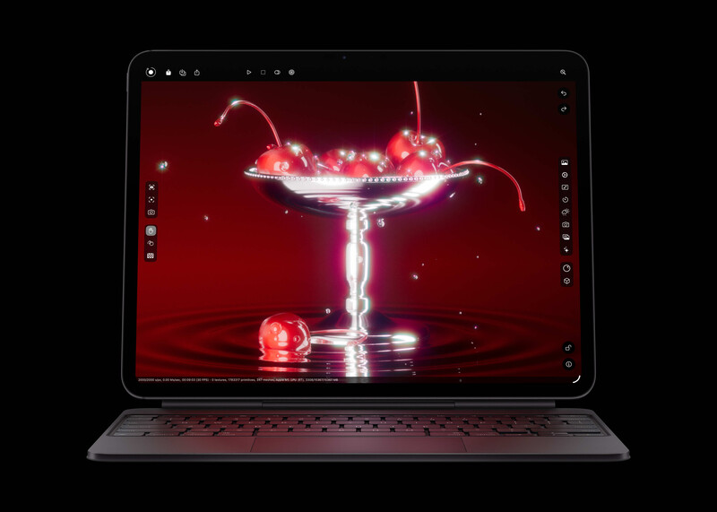 Tablet displaying a high-speed liquid splash photography image with glowing red particles and neon lighting effects.