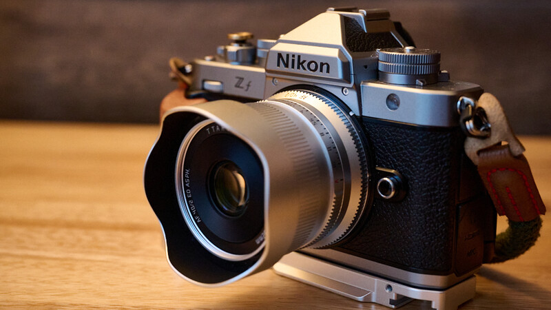 Nikon Z1 mirrorless camera with attached wide-angle lens on wooden surface.