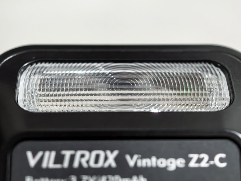 Viltrox Vintage Z2-C camera flash unit with clear dome diffuser and black housing.