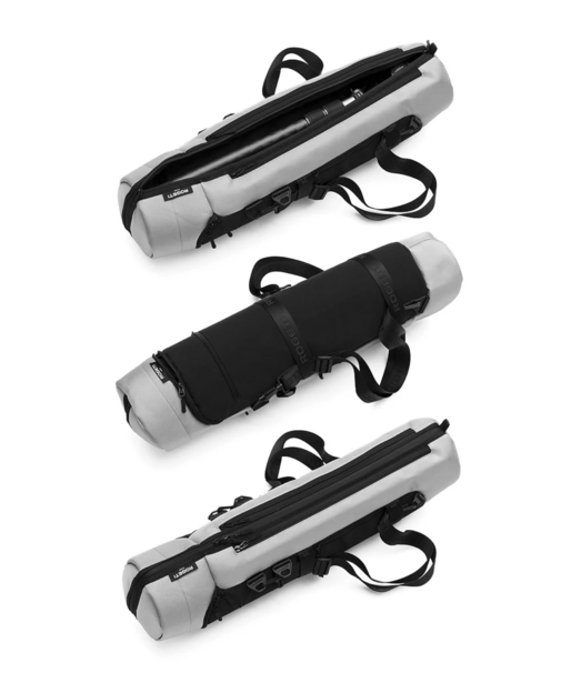 Three cylindrical carrying cases with handles and reflective bands arranged vertically.