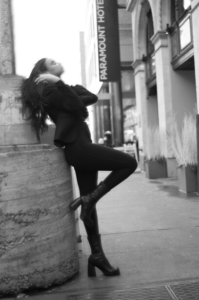 Model leaning on lampost