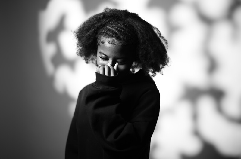 Bashful model hiding her face